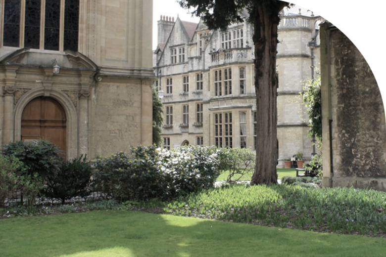 A lawn in Brasenose college, with pale brick buildings with tall windows